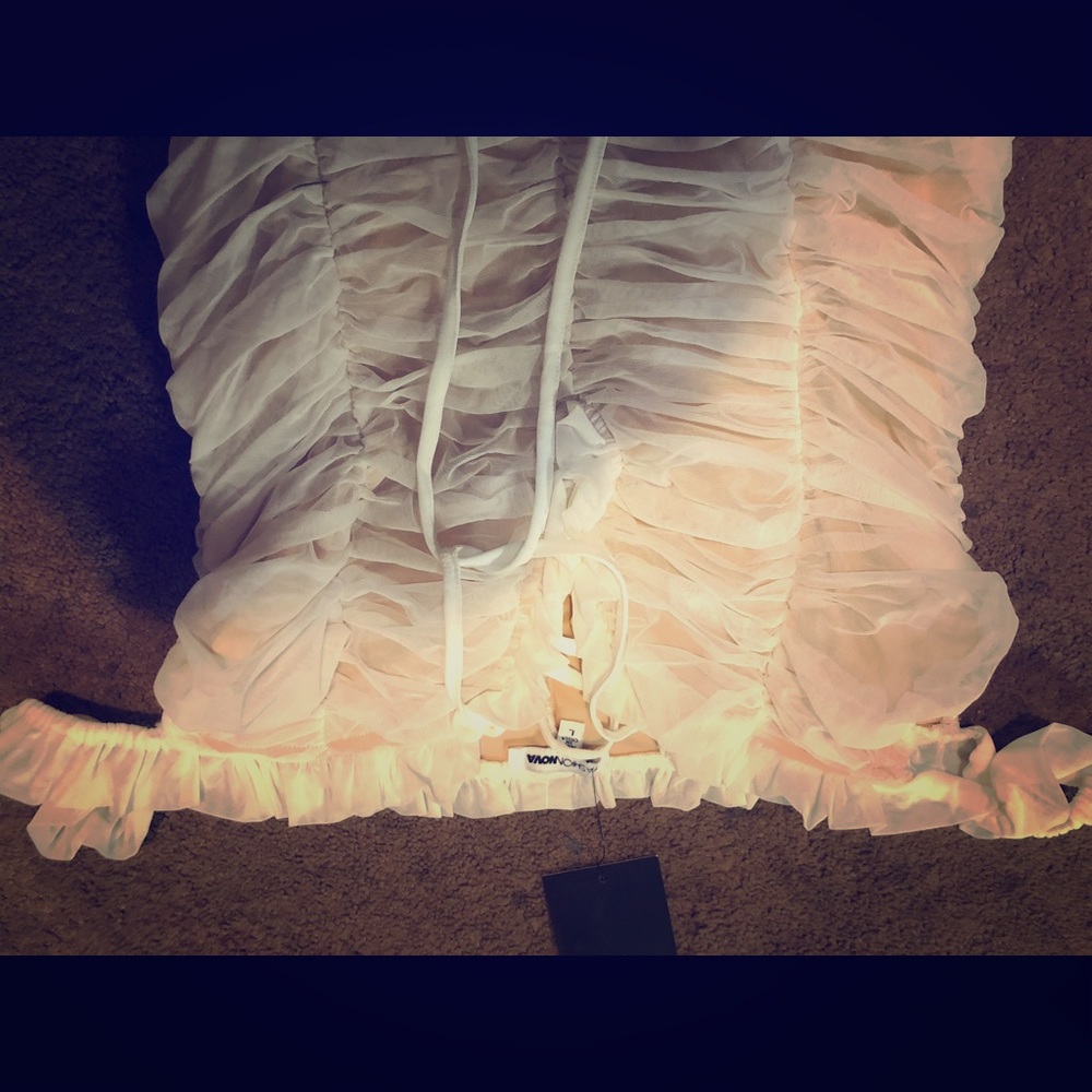 pink tone body suit. never worn w/ tags!